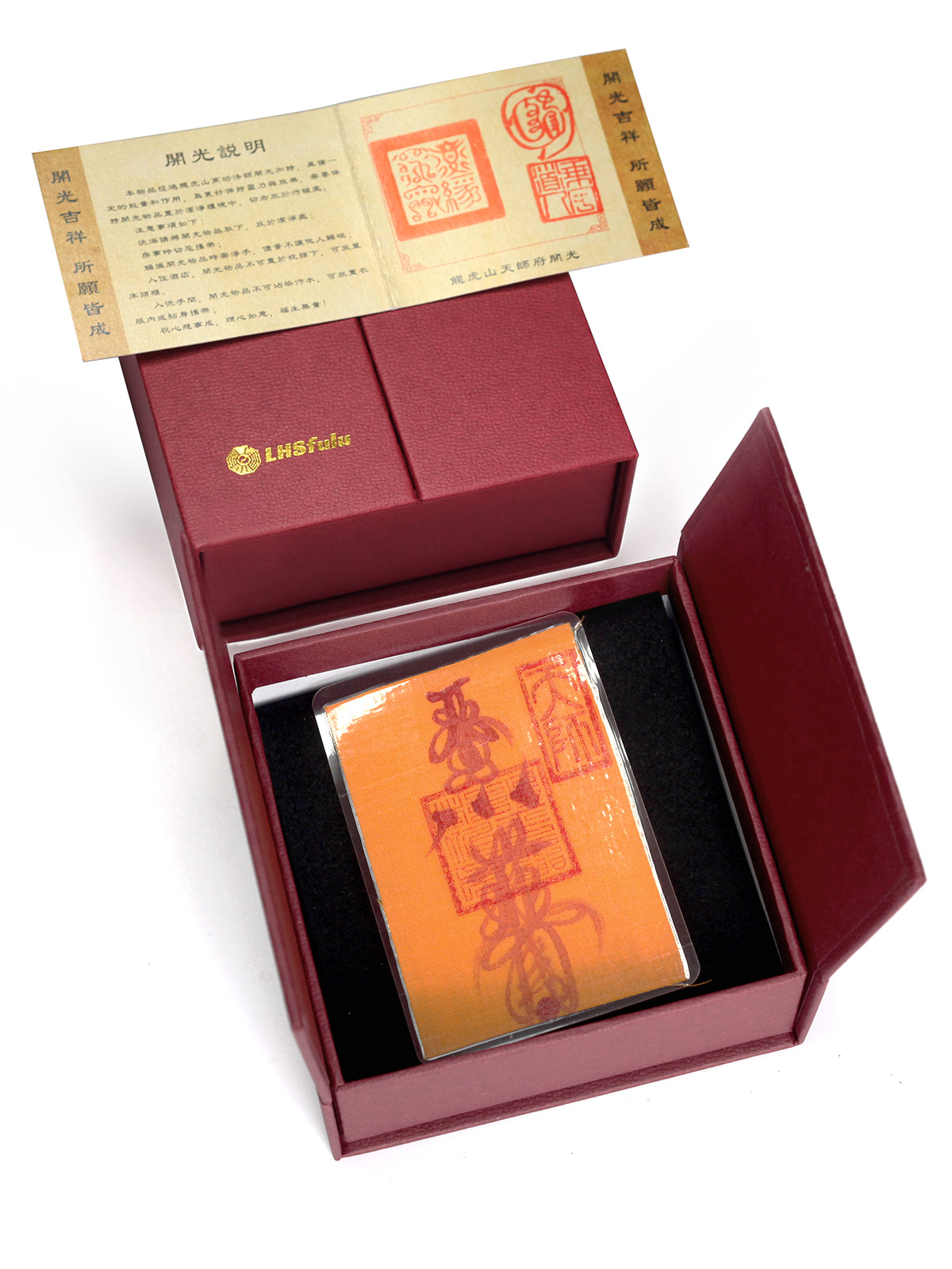 a mobile phone charm or sticker featuring a traditional Chinese Taoist talisman, hand-drawn by a Zhengyi lineage master from Longhu Mountain.