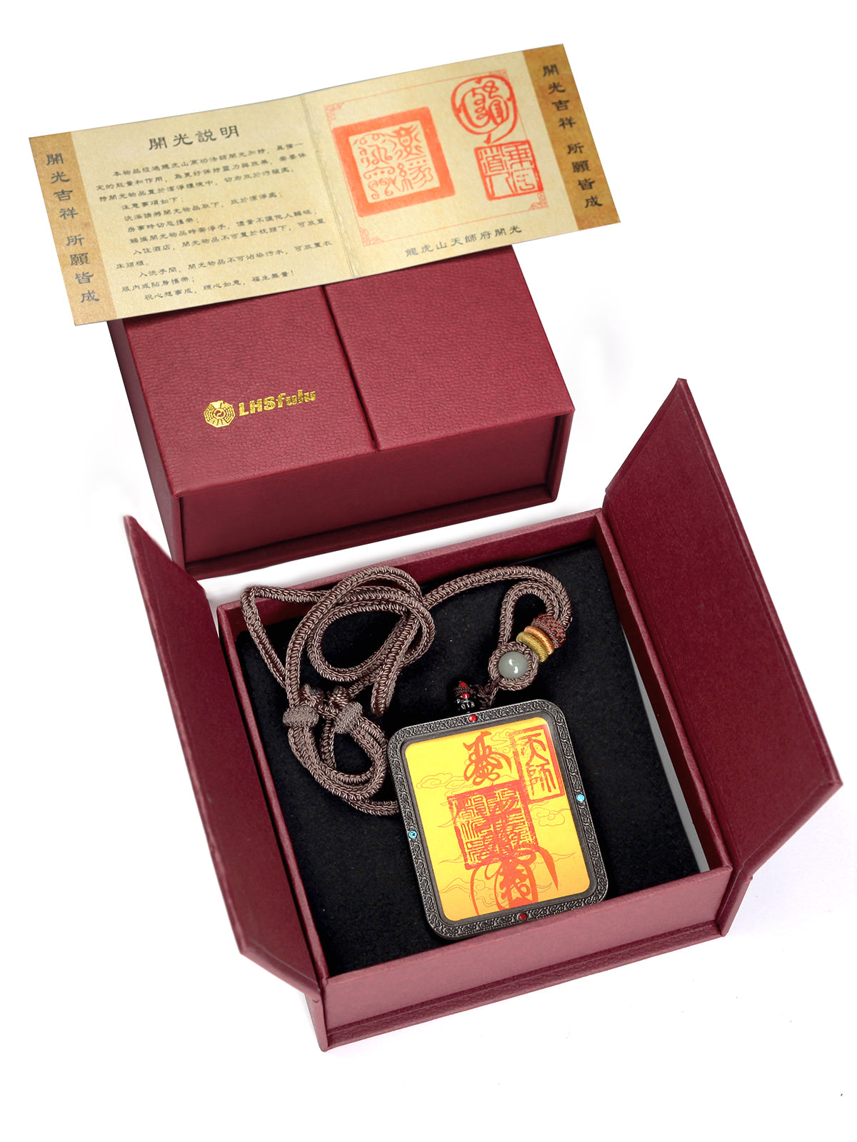 this talisman is personally hand-drawn by an orthodox Taoist master. An initiated High Priest then inscribes the talisman, channeling the sacred energy of the ancestral court, before sealing it within an exquisitely crafted Ghau box. This Peace &amp; Safety Talisman serves to protect your body and safeguard your well-being, warding off malevolent influences and neutralizing negative energy. It helps you steer clear of disasters, mitigates the impact of unforeseen accidents, and provides the wearer with comp