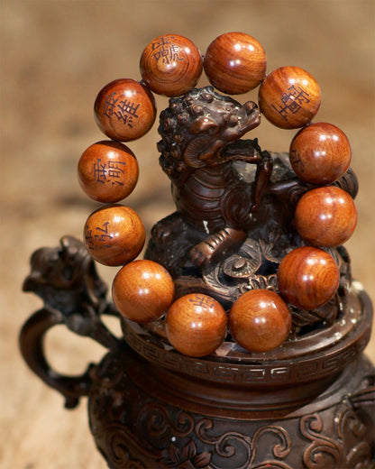This bracelet is crafted from specially selected natural thunderstruck wood of exceptionally strong energy. Upon the surface of the beads are not ordinary talismanic script, but rather the 'Mihui' (Secret Celestial Names), personally hand-drawn by a High Priest of Longhu Mountain. 'Mihui' are the core cosmic passwords and secret designations of the deities in the celestial realm. They are the most direct path to communicating with the power of a specific divinity. Each Secret Name corresponds to a single de