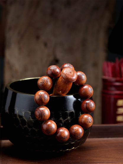 This bracelet is crafted from specially selected natural thunderstruck wood of exceptionally strong energy. Upon the surface of the beads are not ordinary talismanic script, but rather the 'Mihui' (Secret Celestial Names), personally hand-drawn by a High Priest of Longhu Mountain. 'Mihui' are the core cosmic passwords and secret designations of the deities in the celestial realm. They are the most direct path to communicating with the power of a specific divinity. Each Secret Name corresponds to a single de